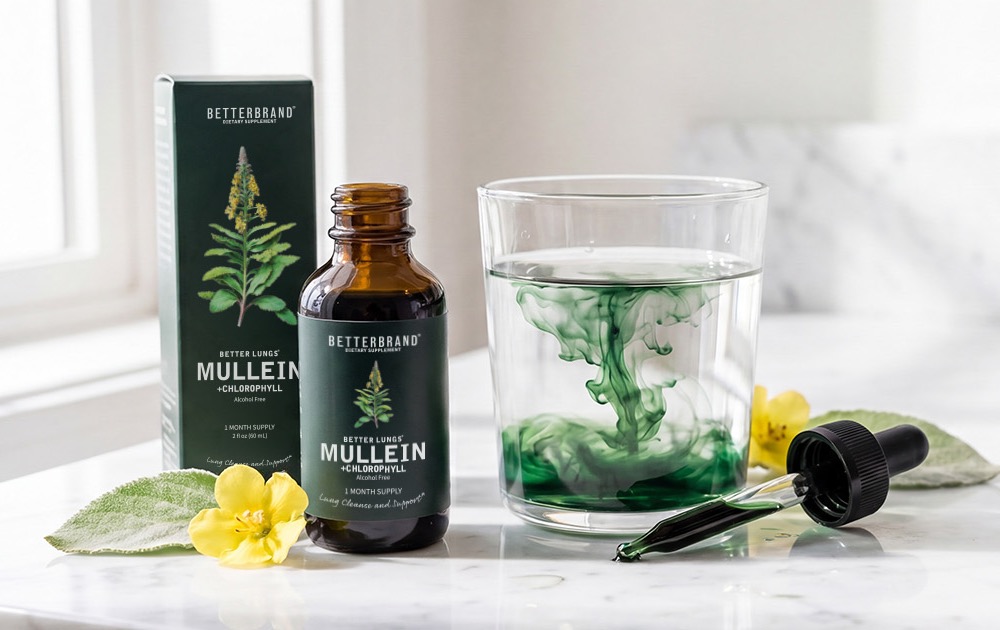 BetterLungs Mullein + Chlorophyll tincture and box beside a glass of water with green chlorophyll dispersing, on a marble counter
